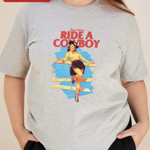 Customer in Chicago, Illinois wearing Save a Horse Ride a Cowboy Tee Retro Pinup Cowgirl Graphic Shirt for Women