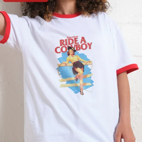 Customer in Chicago, Illinois wearing Save a Horse Ride a Cowboy Tee Retro Pinup Cowgirl Graphic Shirt for Women