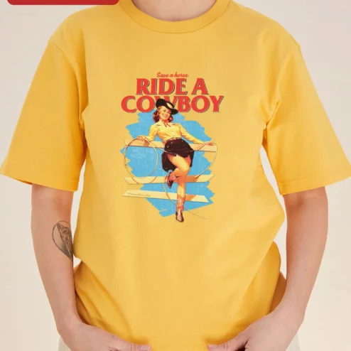 Customer in Chicago, Illinois wearing Save a Horse Ride a Cowboy Tee Retro Pinup Cowgirl Graphic Shirt for Women