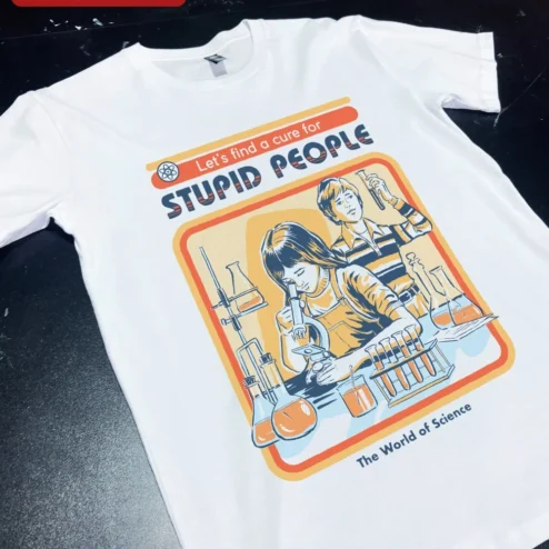 Science Humor Tee Let's Find a Cure for Stupid People Vintage Lab Graphic Shirt on a hanger, ready to ship from Chicago, Illinois