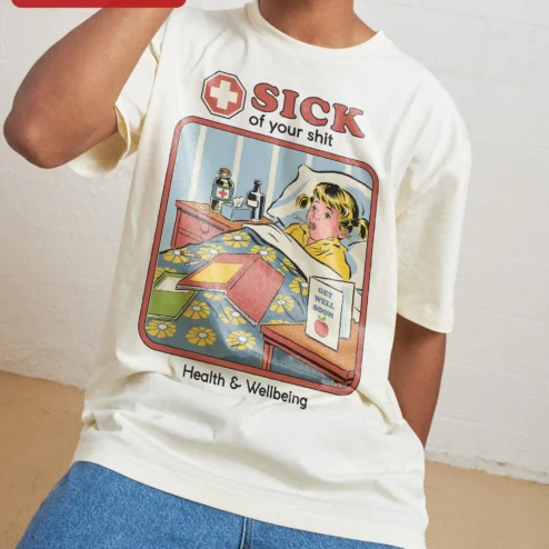 Sick Of Your Shit Health And Wellbeing Tee Retro Comic Sarcastic Humor Shirt on a hanger, ready to ship from Chicago, Illinois