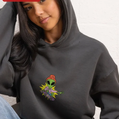 Customer in Chicago, Illinois wearing Skateboarding Alien Graphic Hoodie Streetwear Skate Culture Apparel for Men and Women
