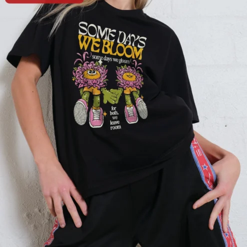 Some Days We Bloom Some Days We Gloom Mental Health Affirmation Ringer Tee on a hanger, ready to ship from Chicago, Illinois