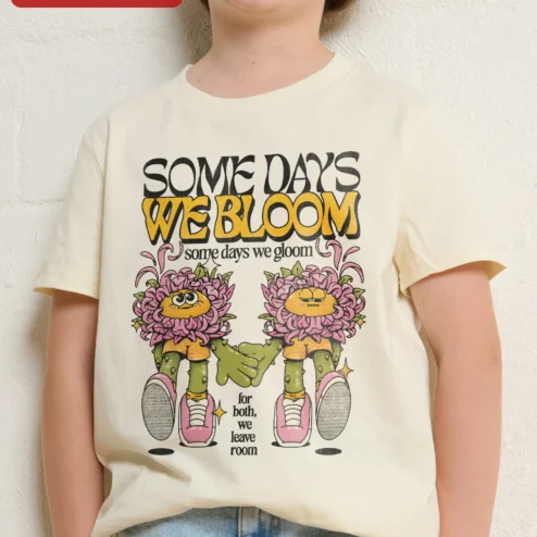 Some Days We Bloom Some Days We Gloom Mental Health Awareness Kids Tee on a hanger, ready to ship from Chicago, Illinois