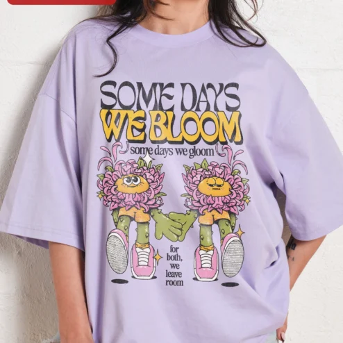 Customer in Chicago, Illinois wearing Some Days We Bloom Some Days We Gloom Mental Health Awareness Oversized Tee Retro Cartoon Flower Gra