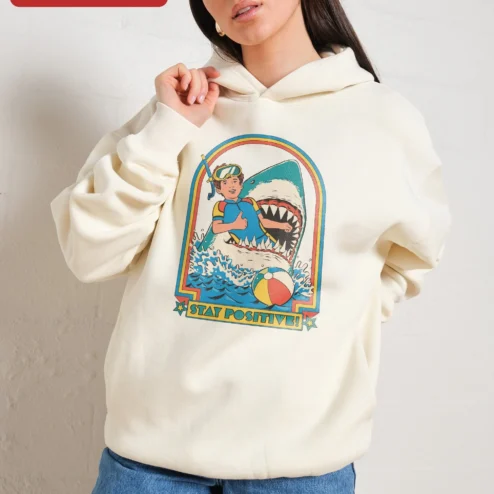 Close-up of Stay Positive Hoodie Retro Scuba Diver Shark Graphic Pullover Funny Ocean Humor Gift for streetwear fans in Chicago, Illinois