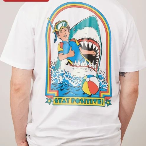 Close-up of Stay Positive! Retro Pop Art Graphic Tee Motivational Quote Shirt for Women Men for streetwear fans in Chicago, Illinois