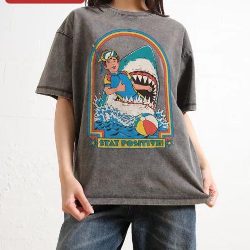 Stay Positive! Retro Scuba Diver Shark Graphic Tee on a hanger, ready to ship from Chicago, Illinois