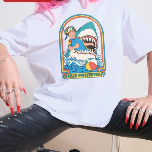 Stay Positive Scuba Diver Shark Retro Graphic Tee Unisex Oversized Cotton Shirt on a hanger, ready to ship from Chicago, Illinois