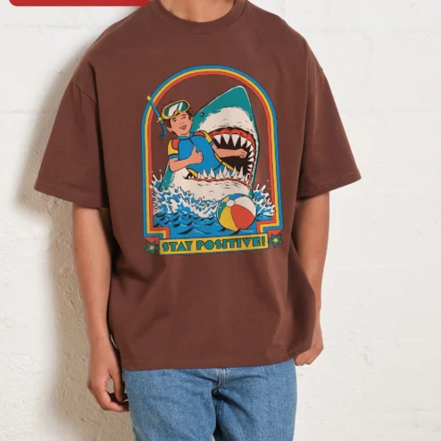 Close-up of Stay Positive Scuba Diver Shark Retro Graphic Tee Unisex Oversized Cotton Shirt for streetwear fans in Chicago, Illinois
