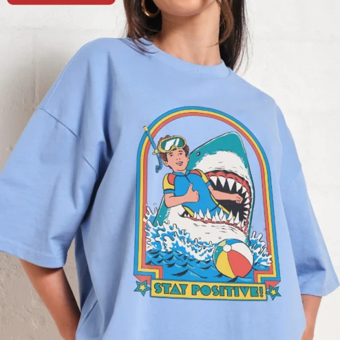 Customer in Chicago, Illinois wearing Stay Positive Scuba Diver Shark Retro Graphic Tee Unisex Oversized Cotton Shirt