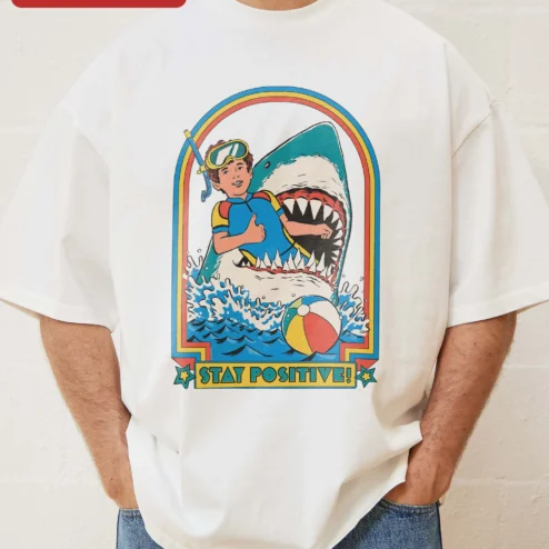 Close-up of Stay Positive Scuba Diver Shark Retro Graphic Tee Unisex Oversized Cotton Shirt for streetwear fans in Chicago, Illinois