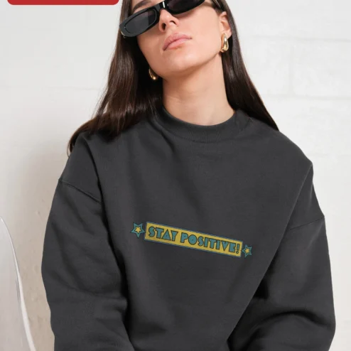 Customer in Chicago, Illinois wearing Stay Positive! Vintage Retro Typography Crewneck Sweatshirt for Men Women Motivational Gift