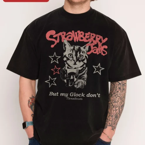 Strawberry Jails But My Glock Don't Meme Cat Graphic Tee on a hanger, ready to ship from Chicago, Illinois