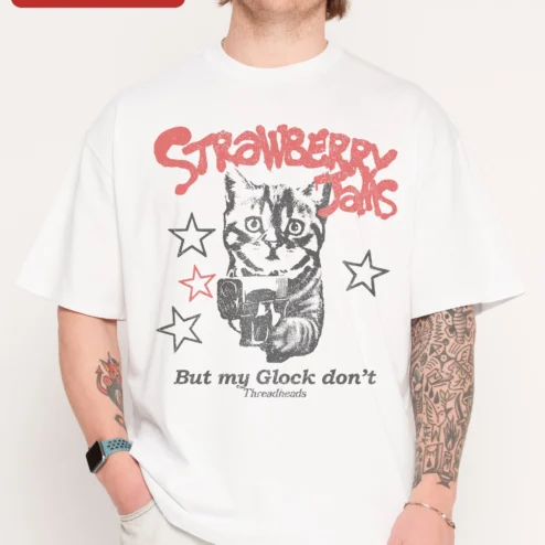 Close-up of Strawberry Jams But My Glock Don't Funny Cat Graphic Tee for streetwear fans in Chicago, Illinois