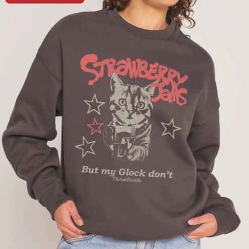 Strawberry Jams But My Glock Don't Sweatshirt Funny Cat Gun Graphic Crewneck on a hanger, ready to ship from Chicago, Illinois