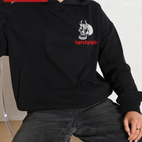 Close-up of SUFFERING? Flaming Skull Hoodie Dark Humor Punk Rock Streetwear Apparel for streetwear fans in Chicago, Illinois