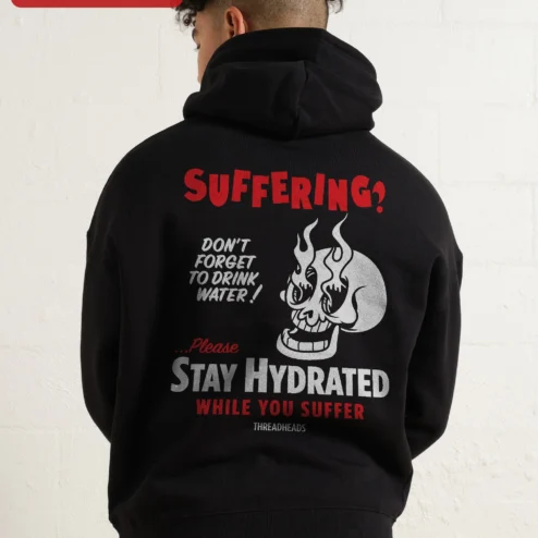 Close-up of SUFFERING? Flaming Skull Hoodie Dark Humor Punk Rock Streetwear Apparel for streetwear fans in Chicago, Illinois