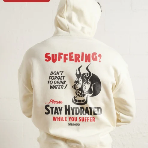 Close-up of SUFFERING? Flaming Skull Hoodie Dark Humor Punk Rock Streetwear Apparel for streetwear fans in Chicago, Illinois