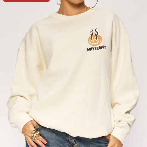 SUFFERING? Halloween Pumpkin Sweatshirt Dark Humor Crewneck for Horror Fans on a hanger, ready to ship from Chicago, Illinois