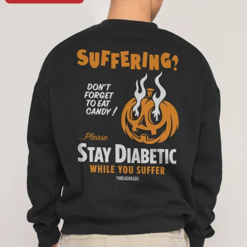 Customer in Chicago, Illinois wearing SUFFERING? Halloween Pumpkin Sweatshirt Dark Humor Crewneck for Horror Fans
