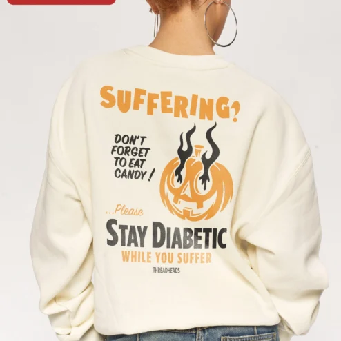 Close-up of SUFFERING? Halloween Pumpkin Sweatshirt Dark Humor Crewneck for Horror Fans for streetwear fans in Chicago, Illinois