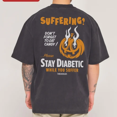 Customer in Chicago, Illinois wearing Suffering? Pumpkin Graphic Tee Halloween Acid Wash Shirt