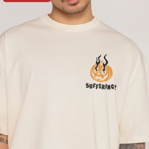 Suffering Pumpkin Halloween Graphic Tee Funny Dark Humor Oversized Shirt on a hanger, ready to ship from Chicago, Illinois