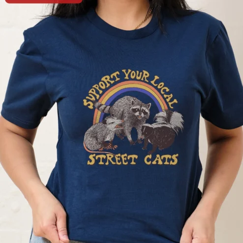 Customer in Chicago, Illinois wearing Support Your Local Street Cats Tee Funny Retro Trash Animals Graphic Shirt Gift for Cat Lovers