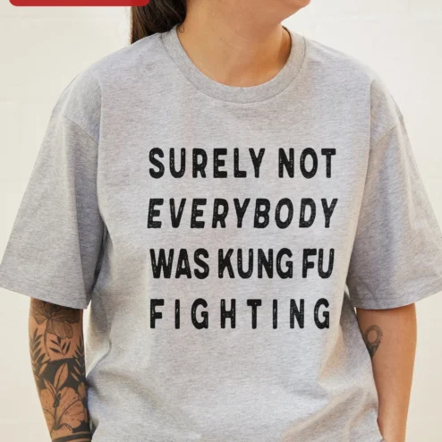 Surely Not Everybody Was Kung Fu Fighting Tee Funny Vintage Music Lyric Shirt Gift for Men Women on a hanger, ready to ship from Chicago, Illinois