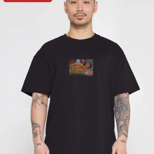 Customer in Chicago, Illinois wearing Surreal Meme Art Tee Absurd Streetwear Oversized Graphic Shirt for Men Women