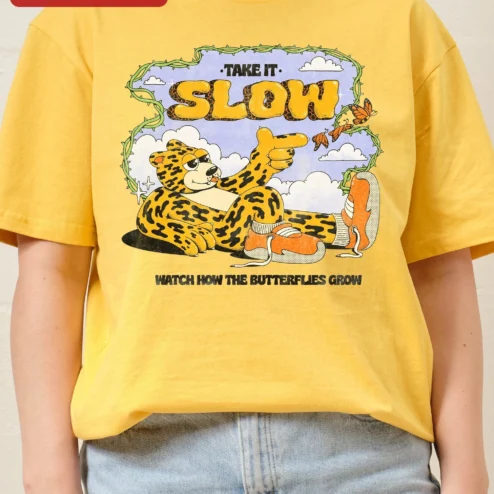 Customer in Chicago, Illinois wearing Take It Slow Watch How The Butterflies Grow Leopard Graphic Tee
