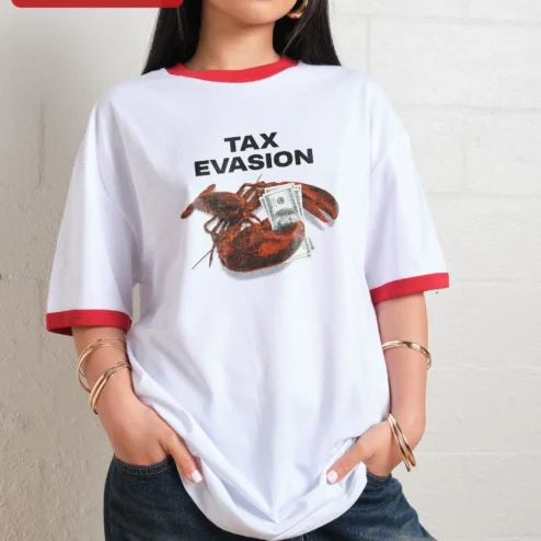 Customer in Chicago, Illinois wearing Tax Evasion Tee Funny Lobster Holding Money Graphic T-Shirt Satirical Seafood Pun Gift for Men Women