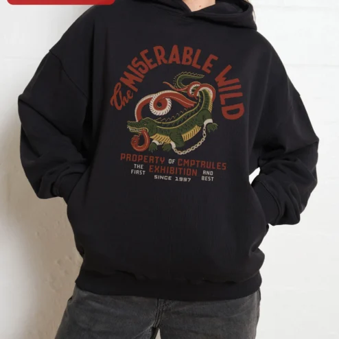Customer in Chicago, Illinois wearing The Miserable Wild Property of CMPTRULES Exhibition Hoodie Vintage Croc Graphic Pullover