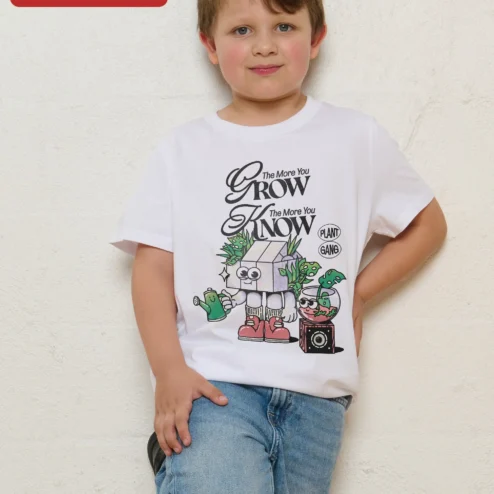 The More You Grow The More You Know Plant Gang Kids Tee Retro Cartoon Gardening Shirt on a hanger, ready to ship from Chicago, Illinois