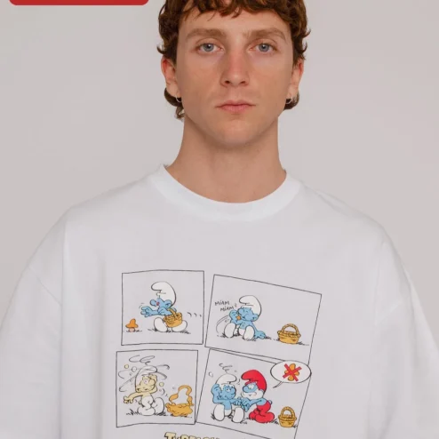 Customer in Chicago, Illinois wearing The Smurfs Tee Oversized Vintage Cartoon Graphic T-Shirt Retro Pop Culture Apparel