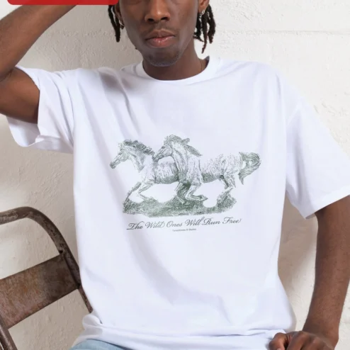 The Wild Ones Will Run Free Tee Vintage Horse Graphic Shirt for Women Nature Lovers on a hanger, ready to ship from Chicago, Illinois