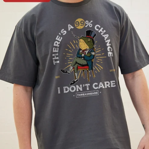 Close-up of There's A 99% Chance I Don't Care Sarcastic Frog Graphic Tee Retro Cartoon Humor Shirt for Introvert for streetwear fans in Chicago, Illinois