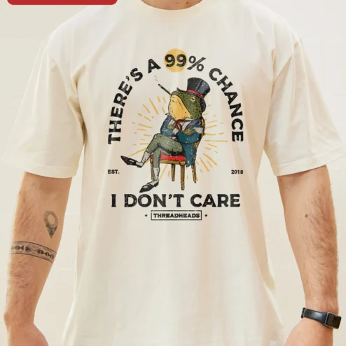 Close-up of There's A 99% Chance I Don't Care Sarcastic Frog Graphic Tee Retro Cartoon Humor Shirt for Introvert for streetwear fans in Chicago, Illinois