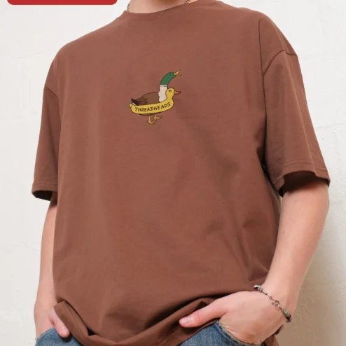 Threadheads Duck Graphic Tee Cartoon Bird Streetwear Cotton Shirt on a hanger, ready to ship from Chicago, Illinois
