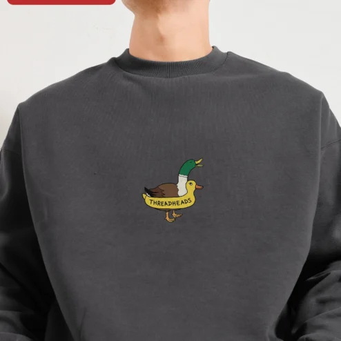 Customer in Chicago, Illinois wearing THREADHEADS Sweatshirt Black Crewneck Embroidered Two Headed Duck Streetwear Pullover
