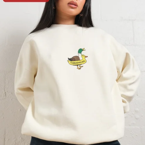Close-up of THREADHEADS Sweatshirt Black Crewneck Embroidered Two Headed Duck Streetwear Pullover for streetwear fans in Chicago, Illinois