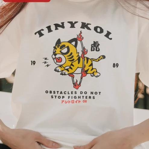 Customer in Chicago, Illinois wearing TINYKOL Obstacles Do Not Stop Fighters Tiger Graphic Tee Men Motivational Streetwear Shirt