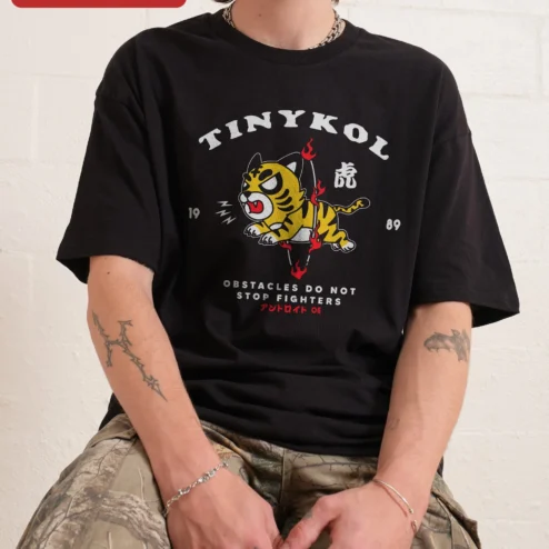 Close-up of TINYKOL Obstacles Do Not Stop Fighters Tiger Graphic Tee Men Motivational Streetwear Shirt for streetwear fans in Chicago, Illinois