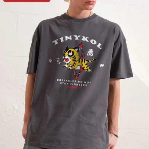 Customer in Chicago, Illinois wearing TINYKOL Obstacles Do Not Stop Fighters Tiger Graphic Tee Men Motivational Streetwear Shirt