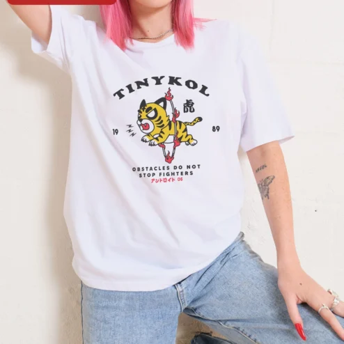 Close-up of TINYKOL Obstacles Do Not Stop Fighters Tiger Graphic Tee Men Motivational Streetwear Shirt for streetwear fans in Chicago, Illinois