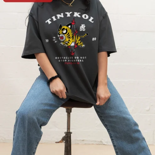 Tinykol Obstacles Do Not Stop Fighters Tiger Graphic Tee Motivational Streetwear Shirt on a hanger, ready to ship from Chicago, Illinois