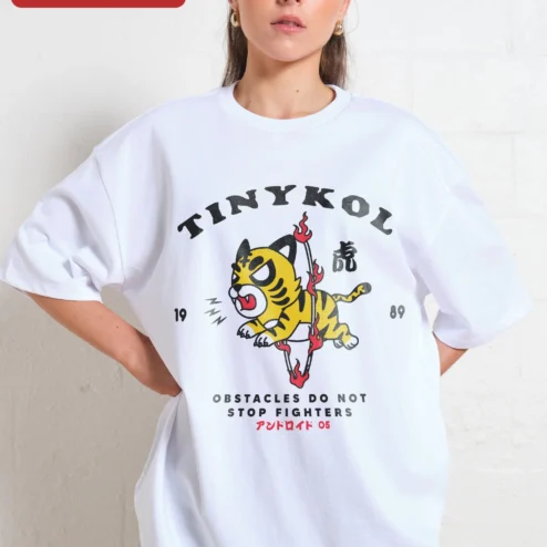 Customer in Chicago, Illinois wearing Tinykol Obstacles Do Not Stop Fighters Tiger Graphic Tee Motivational Streetwear Shirt