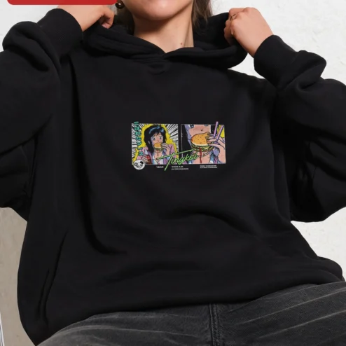 Customer in Chicago, Illinois wearing Tinykol Year A.H. First Humanoid Eating a Burger Hoodie