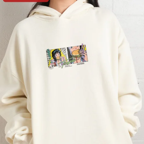 Close-up of Tinykol Year A.H. First Humanoid Eating a Burger Hoodie for streetwear fans in Chicago, Illinois